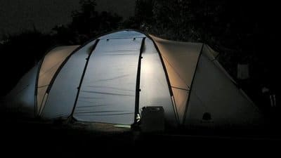 Light on in canvas tent at night