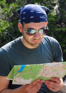 Hiker reading trail map