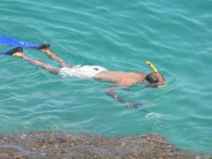 guy snorkeling and spearfishing