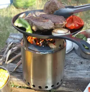 steak cooking on wood stove