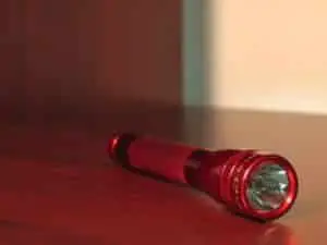 red flashlight on table