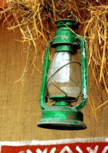 green gas lantern in barn