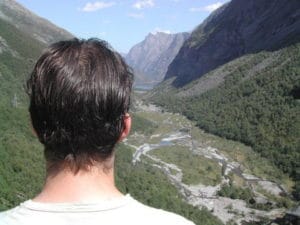 great view creek between two wooded mountains