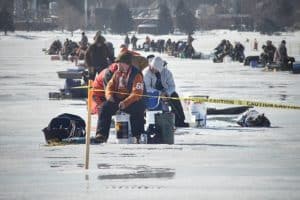 dozens ice fishing on lake