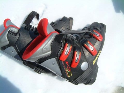 pair of black red gray ski boots