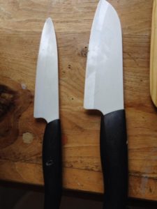 two knives on wood block needing sharpening