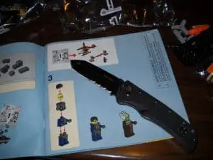 open pocket knife on book