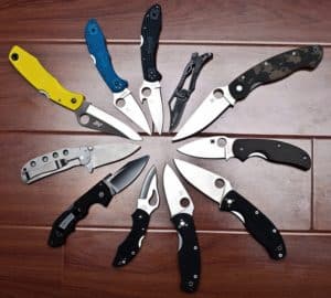 circle of open pocket knives