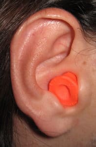 orange earplug in ear