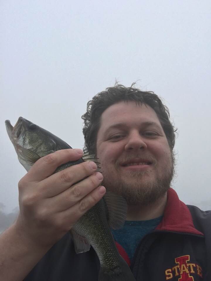 angler holding bass