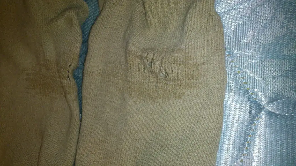 damaged tan athletic socks