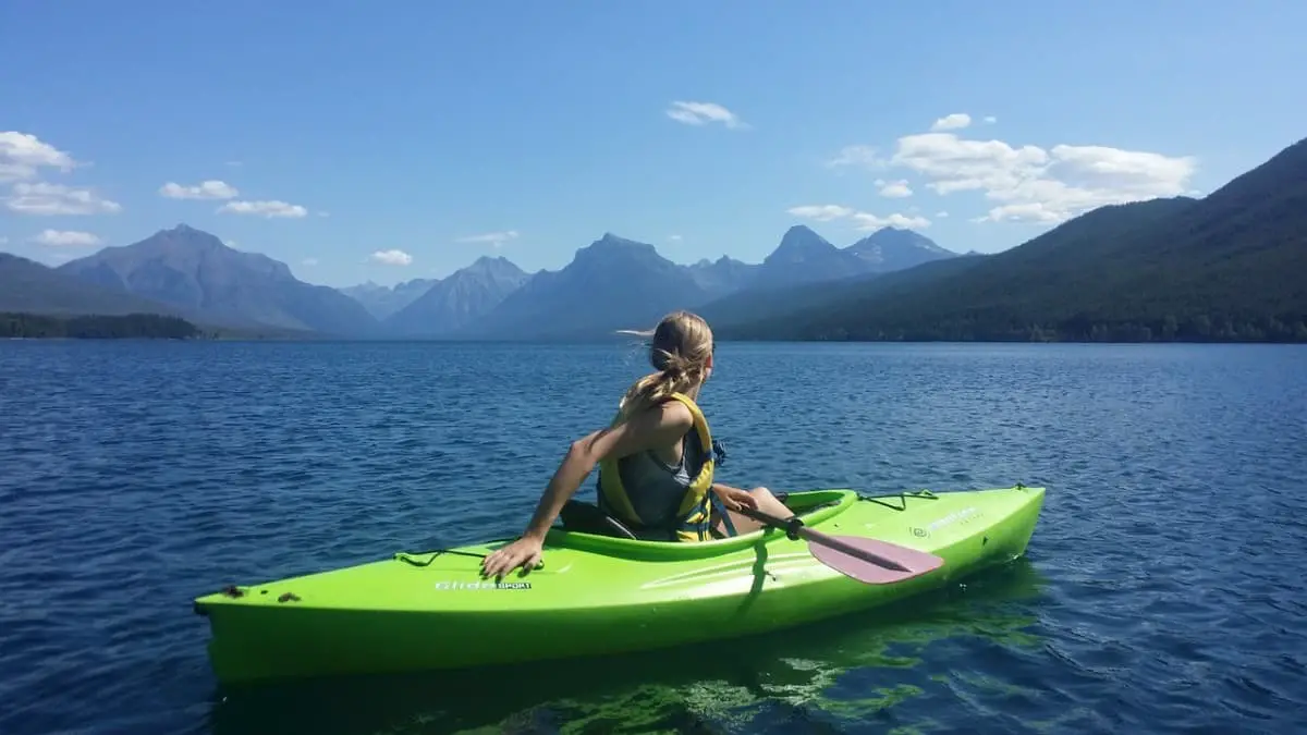 girl kayaking sunny day
