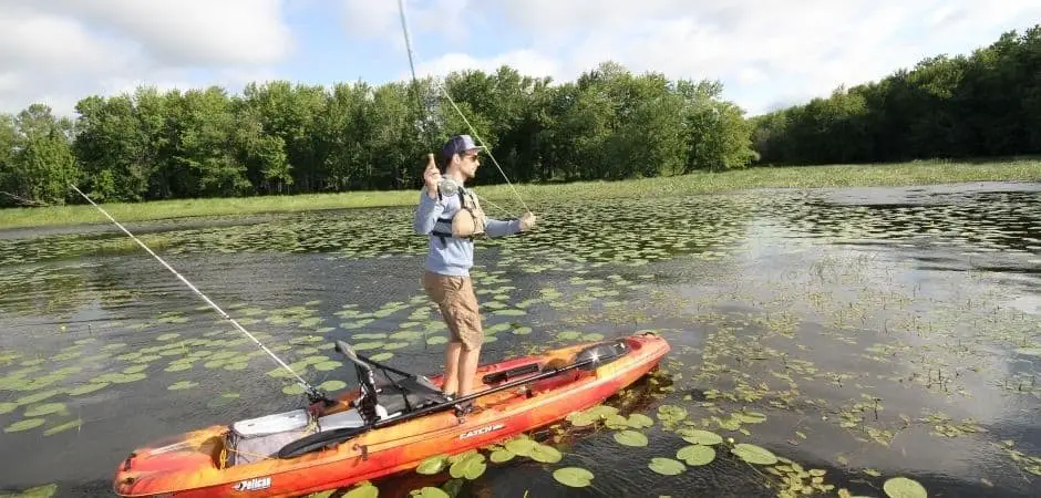 angler standing fishing kayak