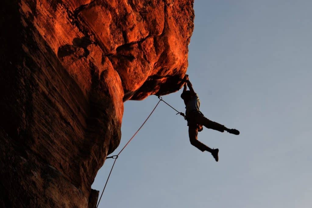 Climbing cliffs at dusk